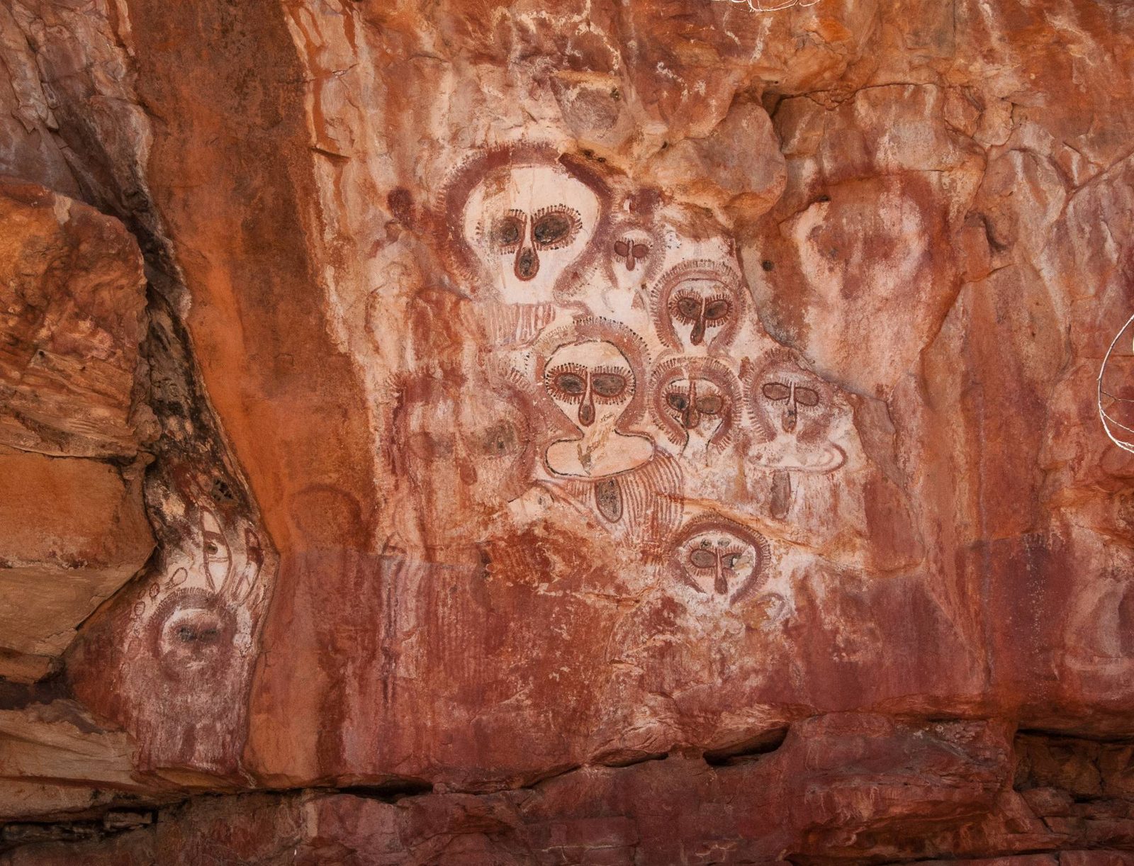 Wandjina figures painted in a Kimberley rock shelter