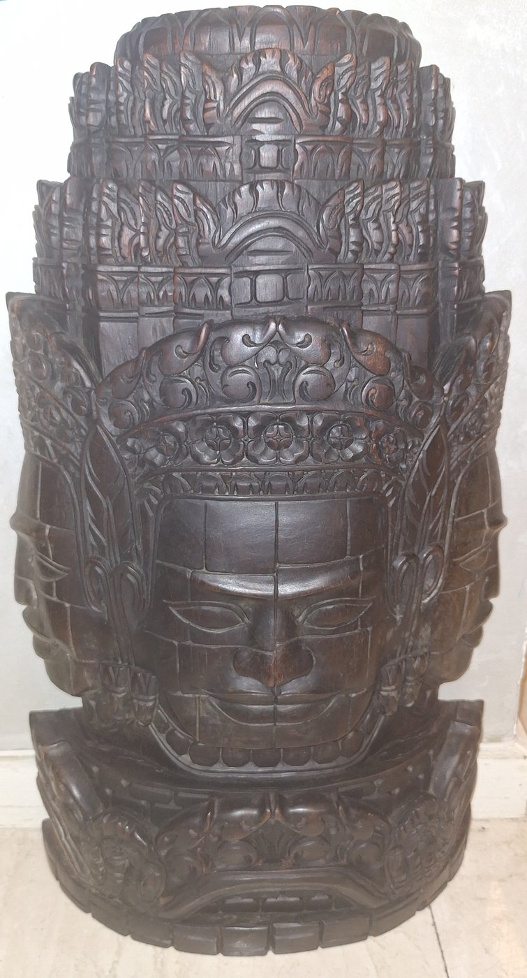 Carved wooden Bayon face of Avalokiteshvara