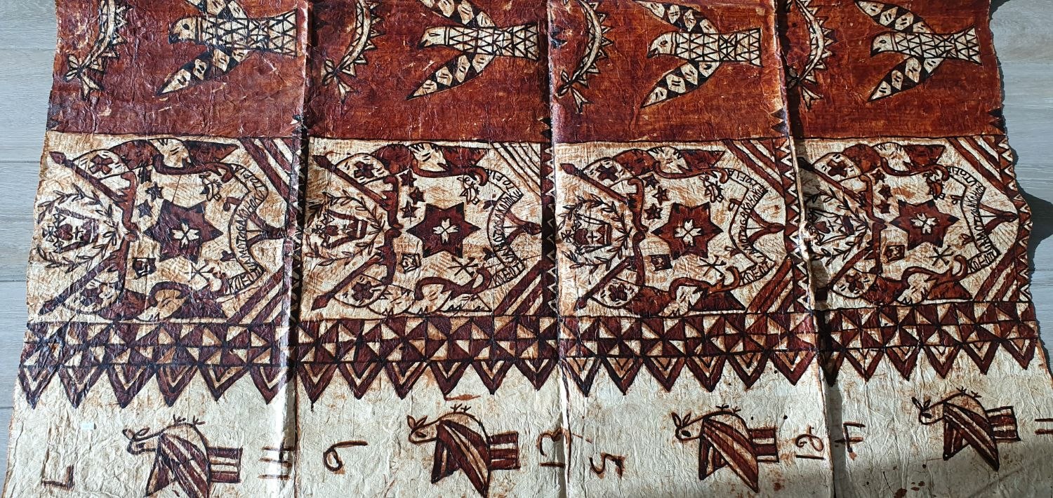 Detail of tapa showing frigate birds, star medallions and triangular borders